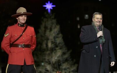 Illustrative: Frank Corbett, the Deputy Premier of Nova Scotia, is flanked by a Royal Canadian Mountie during the lighting of the City of Boston's Christmas tree in Boston, November 29, 2012. The annual gift by Nova Scotia of the tree is in honor of aid that Boston sent following the 1917 explosion of a munitions ship in Halifax harbor that killed more than 1,600. (AP Photo/Charles Krupa)