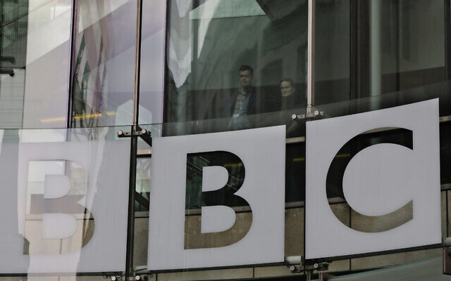 People looks out from inside BBC's New Broadcasting House, in central London, March 28, 2013. (AP Photo/ Lefteris Pitarakis, file)