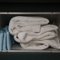 Illustrative: Extra blankets and pads are stored under a bed where women getting abortions rest before and after their procedures, Oct. 9, 2021. (Rebecca Blackwell/AP)