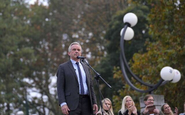 Robert F. Kennedy Jr. pauses as he delivers his speech, during a protest against the COVID-19 vaccination green pass in Milan, Italy, Nov. 13, 2021. (AP Photo/Antonio Calanni)
