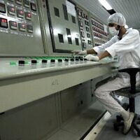 A technician works at the Uranium Conversion Facility just outside the city of Isfahan, Iran, 255 miles (410 kilometers) south of the capital Tehran, Iran, Feb. 3, 2007. (AP Photo/Vahid Salemi, file)