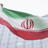 The flag of Iran waves in front of the the International Center building with the headquarters of the International Atomic Energy Agency, IAEA, in Vienna, Austria, on May 24, 2021 (AP Photo/Florian Schroetter, File)
