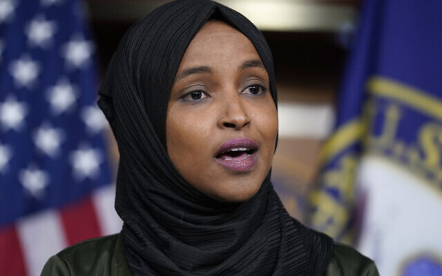 Rep. Ilhan Omar, D-Minn., speaks to reporters in the wake of anti-Islamic comments made last week by Rep. Lauren Boebert, R-Colo., who likened Omar to a bomb-carrying terrorist, during a news conference at the Capitol in Washington, Tuesday, November 30, 2021. (AP Photo/J. Scott Applewhite)