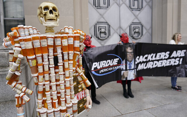 Illustrative: "Pill Mann" made by Frank Huntley of Worcester, Massachusetts, from his opioid prescription pill bottles, is displayed during a protest by advocates for opioid victims outside the Department of Justice, December 3, 2021, in Washington. (AP Photo/Carolyn Kaster)