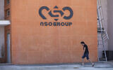 A logo adorns a wall on a branch of the Israeli NSO Group company, near the southern Israeli town of Sapir, on August 24, 2021. (AP Photo/Sebastian Scheiner, File)
