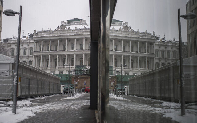 The Palais Coburg, where closed-door Iran nuclear talks take place, reflected in a window in Vienna, Austria, December 9, 2021. (AP Photo/Michael Gruber)
