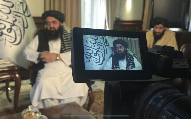 The foreign minister in Afghanistan's new Taliban-run Cabinet, Amir Khan Muttaqi speaks during an interview to the Associated Press in Kabul, Afghanistan, December 12, 2021. (Mohammed Shoaib Amin)