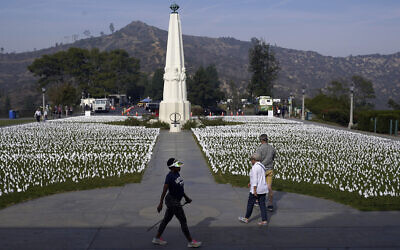 Visitors walk around a memorial for victims of COVID-19 at the Griffith Observatory, in Los Angeles, Nov. 19, 2021. (Marcio Jose Sanchez/AP)