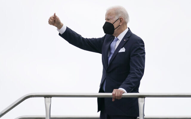 US President Joe Biden gives a thumbs up as he boards Air Force One at Columbia Metropolitan Airport in West Columbia, South Carolina, en route to Philadelphia after speaking at the South Carolina State University's 2021 Fall Commencement Ceremony in Orangeburg, South Carolina, December 17, 2021. (AP Photo/Carolyn Kaster)