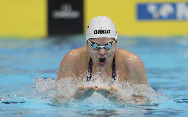 Israel's Anastasia Gorbenko swims to win the 100 meters individual medley with second places Tomoe Has of Norway during World Swimming Championships in Abu Dhabi, United Arab Emirates, December 19, 2021. (AP Photo/ Kamran Jebreili)