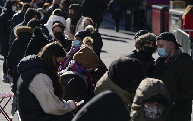 People wait in a long line to get tested for COVID-19 in Times Square, New York, Dec. 20, 2021. (Seth Wenig/AP)