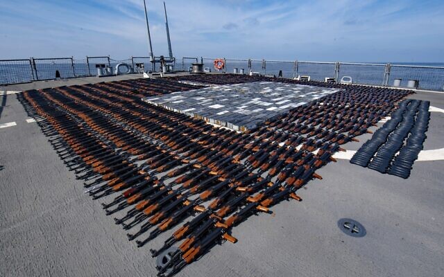 In this Dec. 21, 2021, photo released by the US Navy, Illicit weapons seized from a stateless fishing vessel in the North Arabian Sea are arranged for inventory aboard guided-missile destroyer USS O'Kane's (DDG 77) flight deck (Mass Communication Specialist Seaman Elisha Smith/U.S. Navy via AP)