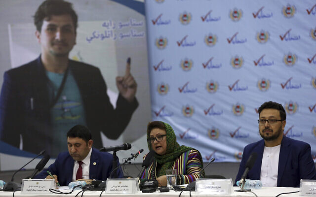 Hawa Alam Nuristani, chief of Election Commission of Afghanistan, center, speaks during a press conference at the Independent Election Commission office in Kabul, Afghanistan, Feb. 18, 2020. (AP Photo/Rahmat Gul)