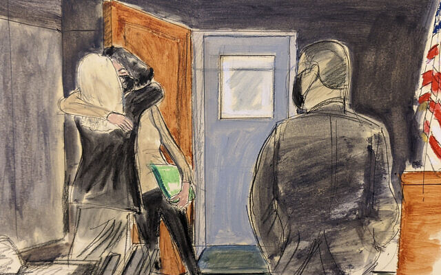 In this courtroom sketch, Ghislaine Maxwell, center, hugs her defense attorney, Laura Menninger, immediately after walking out of lock-up after a four-day break, during Maxwell's sex trafficking trial, December 27, 2021, in New York. (AP Photo/Elizabeth Williams)