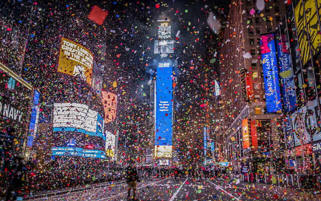 Confetti flies after the Times Square New Year's Eve Ball drops in a nearly empty Times Square due to COVID-19 lockdown, early Friday, January 1, 2021.(AP/Craig Ruttle)