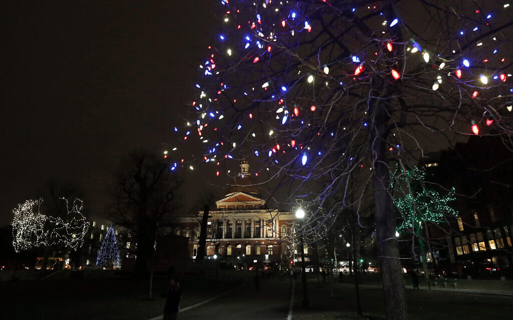 Illustrative: The Massachusetts Statehouse is framed by holiday lights decorating trees on the Boston Common, Tuesday, December 16, 2014, in Boston. (AP Photo/Elise Amendola)