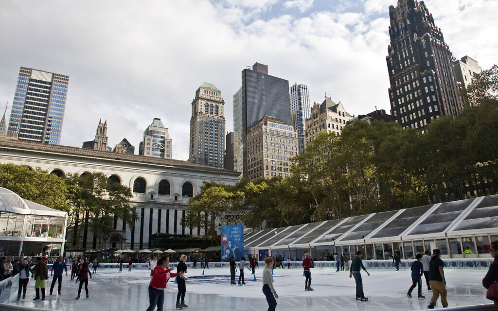 Skaters take to the ice during opening day of the Bryant Park skating rink in midtown New York, Oct. 21, 2014. (AP Photo/Bebeto Matthews, File)