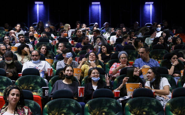 Illustrative -- People at the cinema on May 27, 2021 in Jerusalem (Olivier Fitoussi/Flash90)