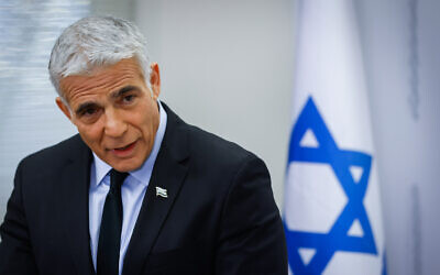 Foreign Minister Yair Lapid speaks during a Yesh Atid faction meeting at the Knesset, on November 8, 2021. (Olivier Fitoussi/Flash90)