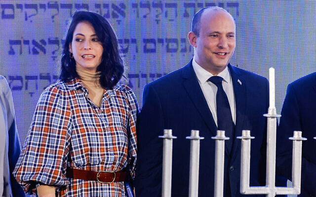 Prime Minister Naftali Bennett and his wife Gilat attend a Hanukkah ceremony in Jerusalem, on November 29, 2021.(Olivier Fitoussi/Flash90)