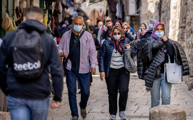 People walk in Jerusalem's Old City on December 5, 2021 (Yonatan Sindel/Flash90)