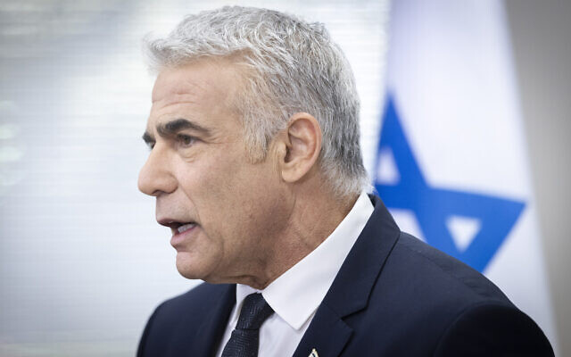 Foreign Minister Yair Lapid speaks during a Yesh Atid faction meeting at the Knesset on December 6, 2021. (Oliver Fitoussi/Flash90)