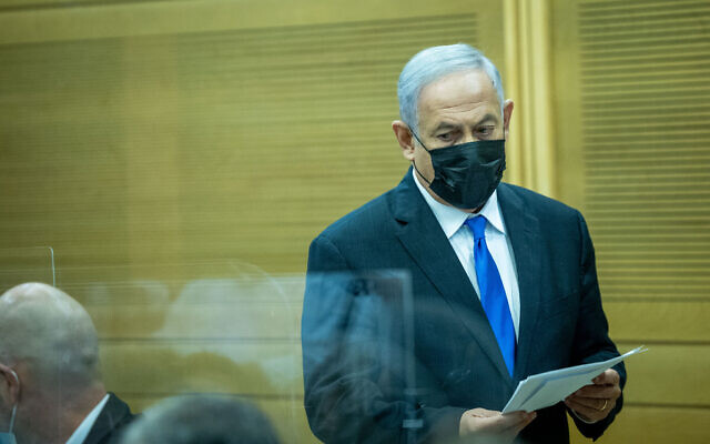 Opposition leader Benjamin Netanyahu during a Likud faction meeting at the Knesset, on December 13, 2021. (Yonatan Sindel/Flash90)