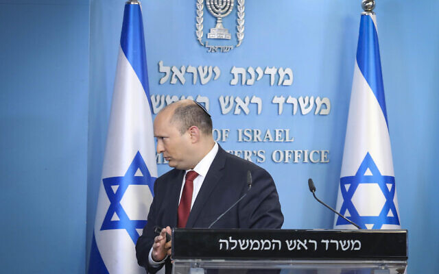 Prime Minister Naftali Bennett holds a press conference at the Prime Minister's Office in Jerusalem on December 19, 2021. (Marc Israel Sellem/Flash90/pool)