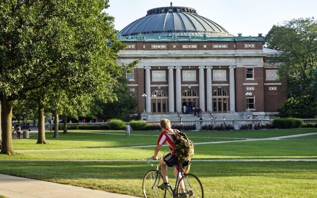 A student bikes across campus at the University of Illinois at Urbana-Champaign. (Jeffrey Greenberg/ Universal Images Group via Getty Images)