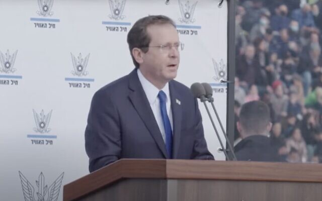 President Isaac Herzog speaks during a ceremony for graduates of the Israeli Air Force's pilot course, at the Hatzerim airbase in southern Israel, on December 22, 2021. (Screen capture: YouTube)