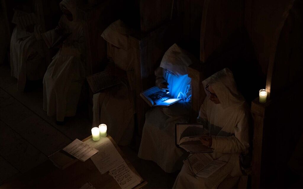 Catholic nuns from the Sisters of Bethlehem pray during a Christmas Eve mass at the Beit Jamal Monastery near Beit Shemesh, Israel, December 24, 2021. (AP Photo/Oded Balilty)