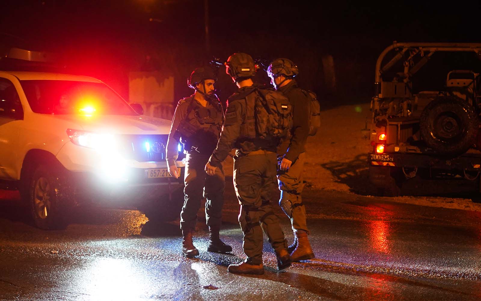 Troops at the scene of a shooting attack near Homesh in the West Bank, on December 16, 2021. (Hillel Maeir/Flash90)