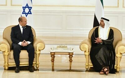 Prime Minister Naftali Bennett sits with UAE Foreign Minister Abdullah bin Zayed in Abu Dhabi on December 12, 2021. (Haim Zach/GPO)