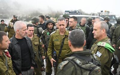 IDF chief Aviv Kohavi speaks with military and security officials at the scene of a shooting attack near Homesh in the West Bank, on December 17 2021. (Israel Defense Forces)