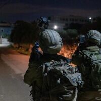 Israeli special forces conduct a raid in the village of Silat al-Harithiya, near Jenin to arrest the men suspected of having carried out a deadly shooting attack outside the Horesh outpost in the West Bank earlier in the week, on December 19, 2021. (Israel Defense Forces)