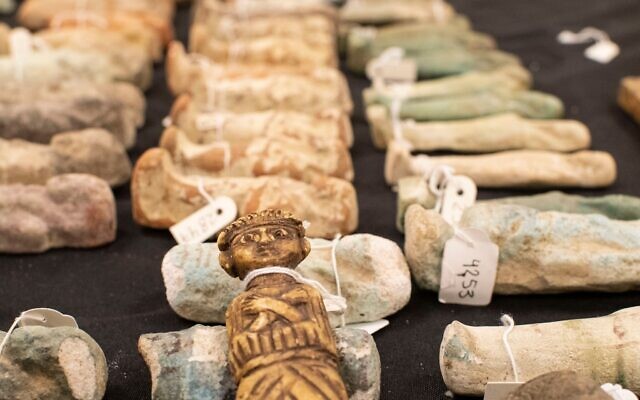 Some of the 95 stolen artifacts returned to Egypt by Foreign Minister Yair Lapid and IAA head Eli Eskozido, December 9, 2021 (Yoli Schwartz/IAA)