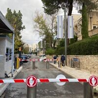Pedestrians on Balfour Street, in the section closed to cars, with the Prime Minister's Residence behind them, December 24, 2021. (David Horovitz/Times of Israel)
