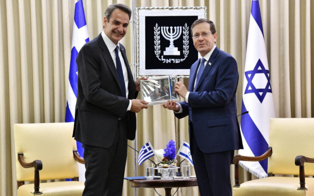 President Isaac Herzog (left) holds a diplomatic working meeting with Greek Prime Minister Kyriakos Mitsotakis in Jerusalem, December 7, 2021 (Haim Zach/GPO)