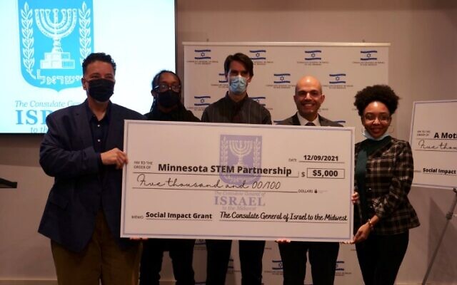 Israel's Consul General to the Midwest Yinam Cohen (2nd from R) presents a social impact grant to the Minnesota STEM Partnership on December 8, 2021. (Israeli Consulate in Chicago)