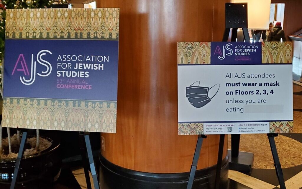 Signs at the 53rd Association of Jewish Studies Annual Conference, held at the Sheraton Grand Chicago, December 19-21, 2021, show rules requiring participants to wear masks. (Rachel Kohn/ JTA)