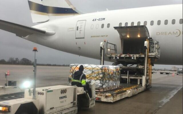 The first shipment of Pfizer's Paxlovid pills is seen being offloaded from a plane at Ben Gurion Airport, December 30, 2021. (Courtesy)