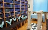 Masonic collars are seen next to book shelves at the Poznan University Library, housing a historic archive of Freemasonry in Europe amassed by the Nazis, in Poznan, western Poland on December 22, 2021. (JANEK SKARZYNSKI / AFP)
