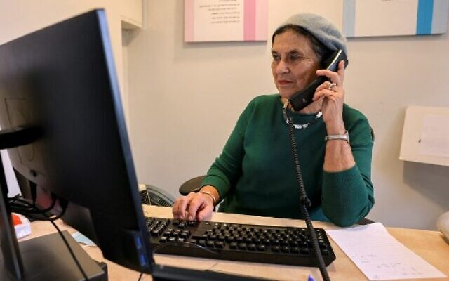 A hotline responder works at the Tahel, Crisis Center for Religious Women and Children, in Jerusalem on January 5, 2022. - "Lo Tishtok" - Hebrew for "You shall not be silent" - is a phrase gaining momentum among ultra-Orthodox Jews, or Haredim, who are being forced to reckon with claims of serious crimes, including sexual abuse of children, against several of their cultural icons. (Photo by AHMAD GHARABLI / AFP)