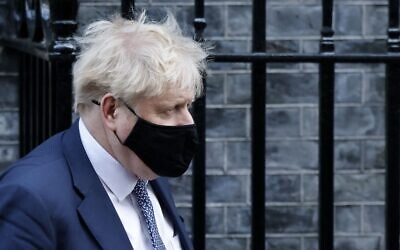 Britain's Prime Minister Boris Johnson leaves from 10 Downing Street in central London on January 12, 2022. (Tolga Akmen / AFP)