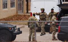 SWAT team members deploy near Congregation Beth Israel, a synagogue in Colleyville, Texas, on January 15, 2022.(Andy Jacobsohn/AFP)