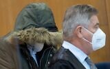 Defendant Alaa M (L), accused of crimes against humanity including torture and murder in his war-torn homeland Syria, stands next to his lawyer Ulrich Endres (R) as he waits on January 19, 2022 at court in Frankfurt am Main, western Germany (Boris Roessler / POOL / AFP)