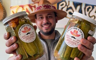 Edward Ilyasov, 29, left his job in finance to pursue opening a pickle store full time after years of feeling unfulfilled. (Courtesy/ via JTA)