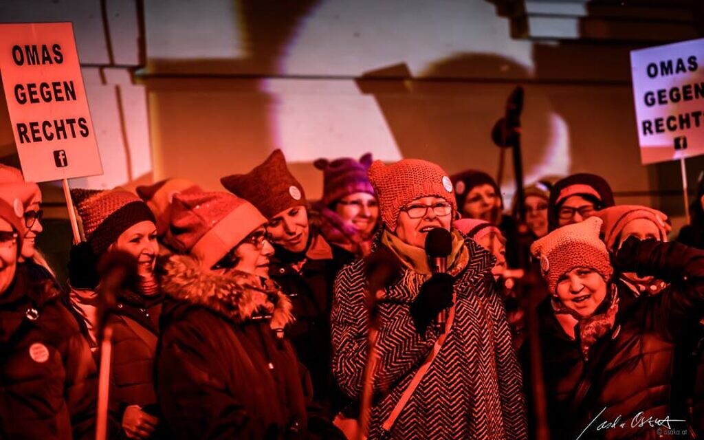 Monika Salzer speaks at a rally with fellow members of the Omas Gegen Rechts group, or Grandmas Against The Right, which she co-founded in 2017. (Omas Gegen Rechts/via JTA)
