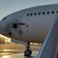 This image released by Iraq's Transport Ministry shows a damaged airliner after rockets were fired at Baghdad airport, January 28, 2022. (Facebook/Courtesy)