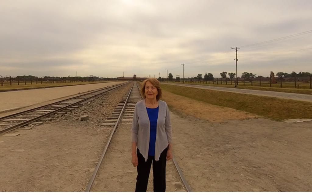 Fritzie Fritzshall at the arrival ramp to Auschwitz in a scene from 'A Promise Kept,' one of the films showing at the virtual reality exhibition 'The Journey Back' at the Illinois Holocaust Museum in Chicago. (Courtesy)